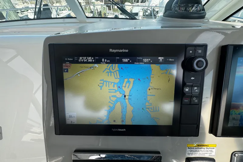 Slide: The Image of Raymarine navigation display on 2016 Boston Whaler 315 Conquest boat, showing detailed marine map. - 82