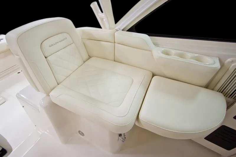 Slide: The Image of Manufacturer Provided Image: Luxurious seating on 2021 Grady-White Express 330 boat with white leather upholstery. - 13
