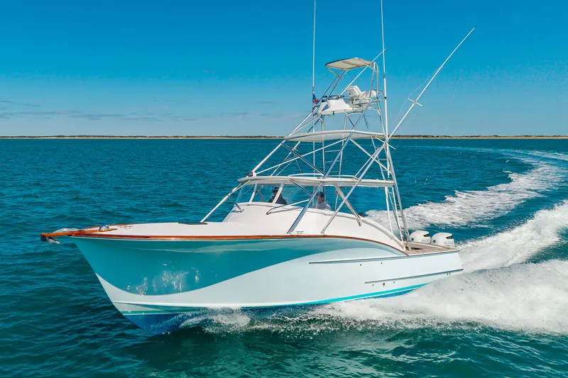 The Image of 2009 Custom Carolina 36 Express cruising on open sea. - 0