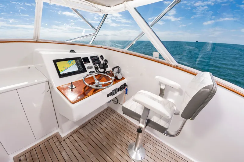 Slide: The Image of Helm of 2009 Custom Carolina 36 Express yacht with ocean view. - 16