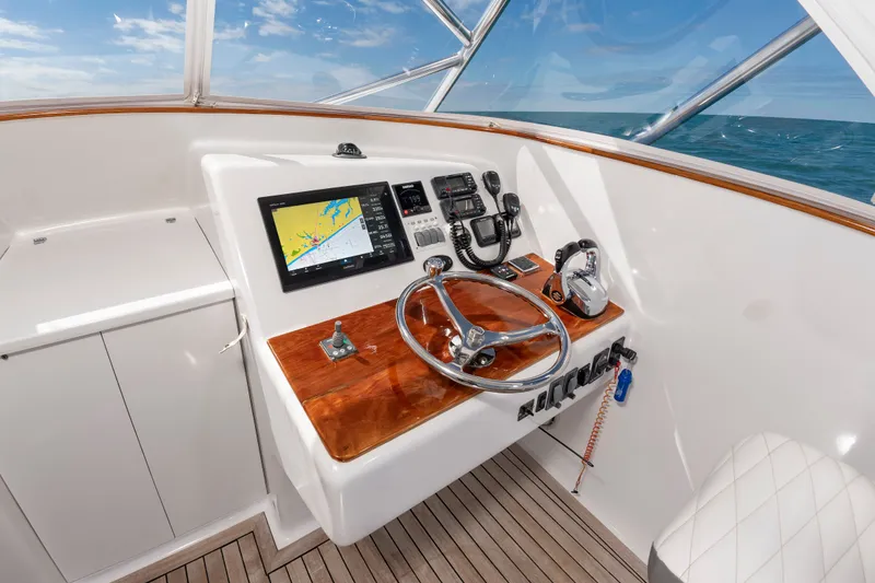 Slide: The Image of Helm of 2009 Custom Carolina 36 Express with navigation system. - 17