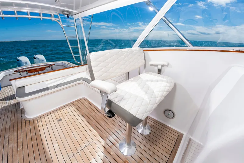 Slide: The Image of Interior of 2009 Custom Carolina 36 Express yacht with white seating. - 19