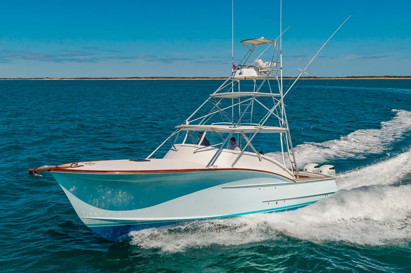 Slide: The Image of 2009 Custom Carolina 36 Express yacht cruising on open sea. - 2