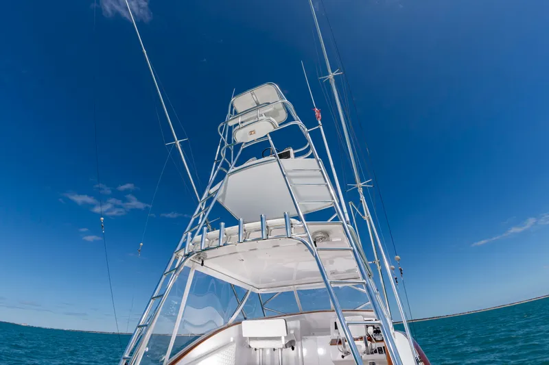 Slide: The Image of Custom Carolina 36 Express 2009 on open sea under blue sky. - 22