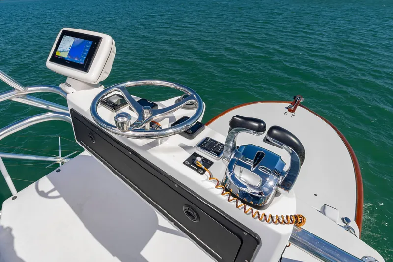 Slide: The Image of Helm of Custom Carolina 36 Express 2009 on open sea. - 24