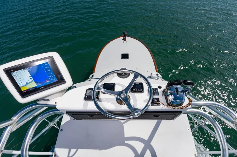 Slide: The Image of Helm of Custom Carolina 36 Express 2009 on open water. - 25