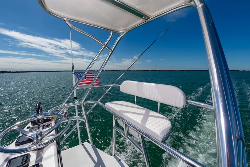 Slide: The Image of Custom Carolina 36 Express 2009 on open sea with American flag. - 27