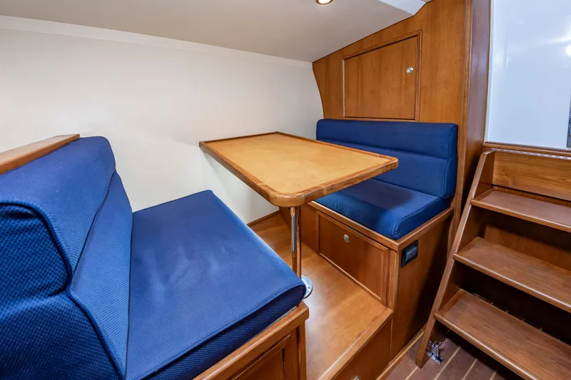Slide: The Image of Interior of 2009 Custom Carolina 36 Express with blue seating. - 29