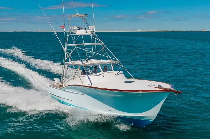 Slide: The Image of 2009 Custom Carolina 36 Express cruising on open sea. - 38