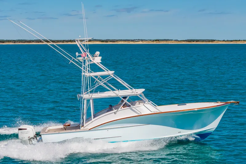 Slide: The Image of 2009 Custom Carolina 36 Express boat on open sea. - 40
