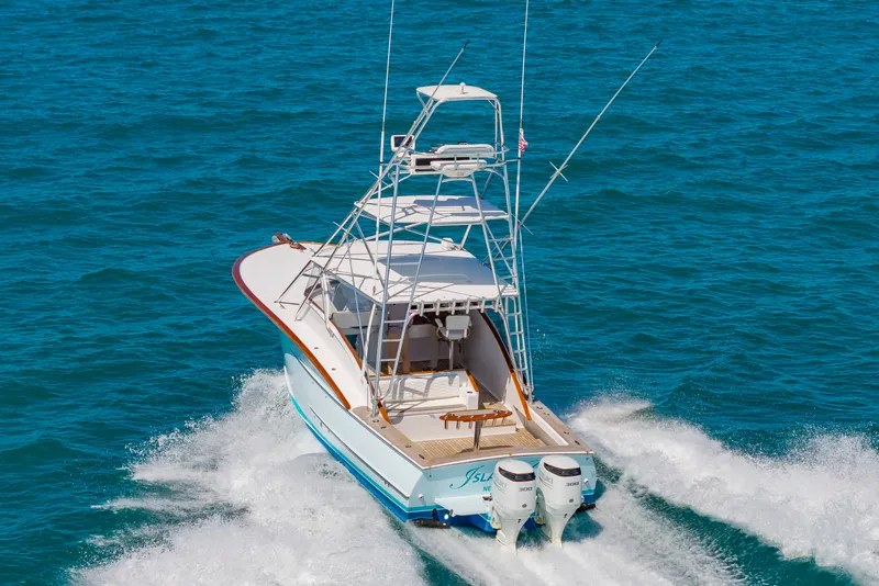 Slide: The Image of 2009 Custom Carolina 36 Express boat on open sea. - 43