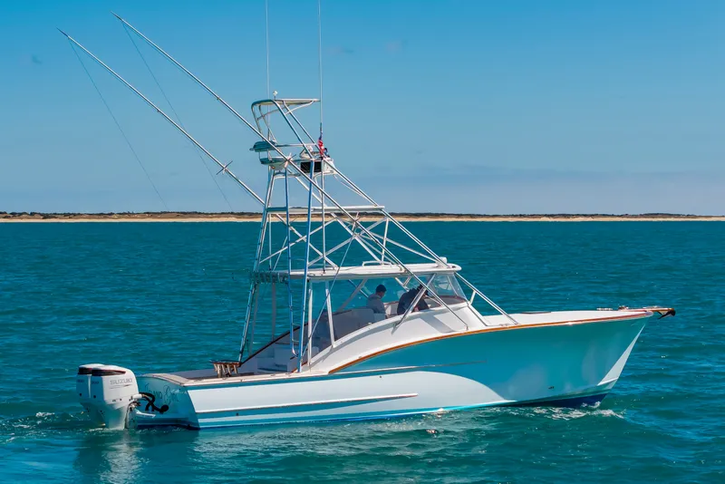 Slide: The Image of 2009 Custom Carolina 36 Express boat on open sea. - 47