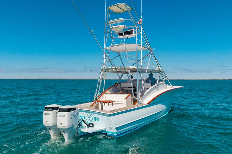 Slide: The Image of 2009 Custom Carolina 36 Express boat on open sea. - 48