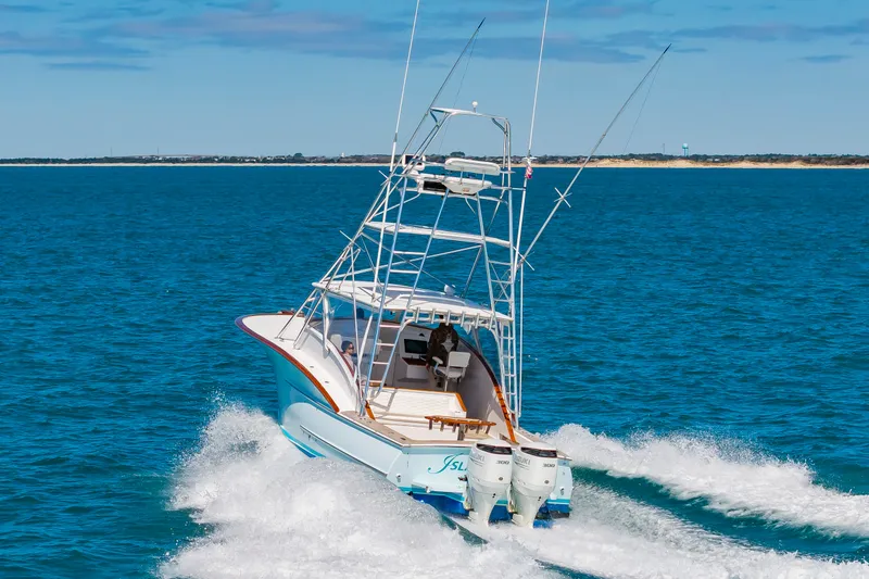 Slide: The Image of 2009 Custom Carolina 36 Express boat on open sea. - 5
