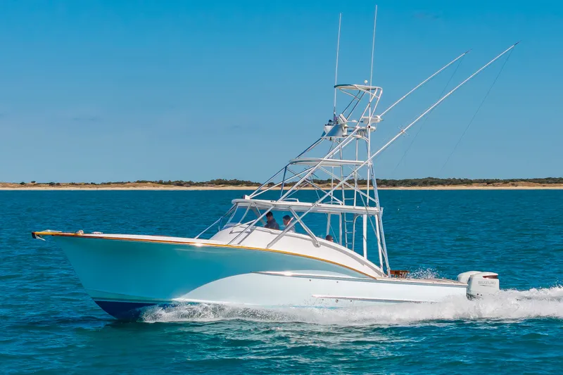 Slide: The Image of 2009 Custom Carolina 36 Express boat cruising on water. - 6