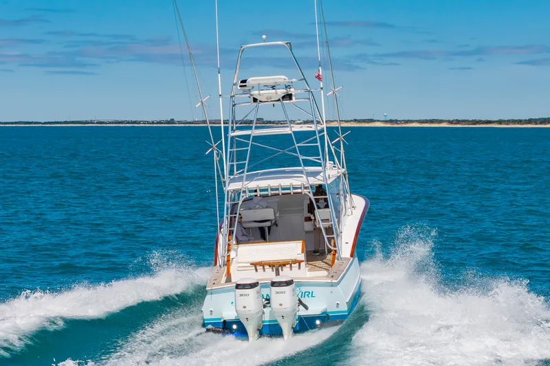 Slide: The Image of 2009 Custom Carolina 36 Express boat cruising on open sea. - 8