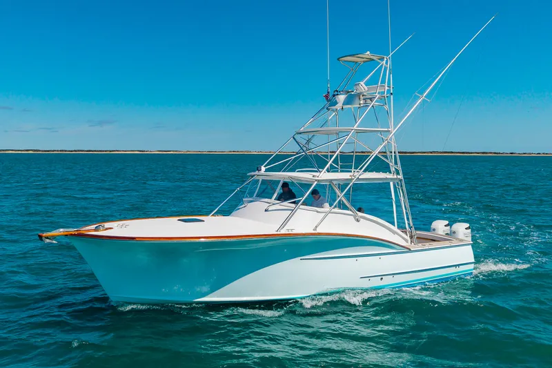Slide: The Image of 2009 Custom Carolina 36 Express boat on open sea. - 9