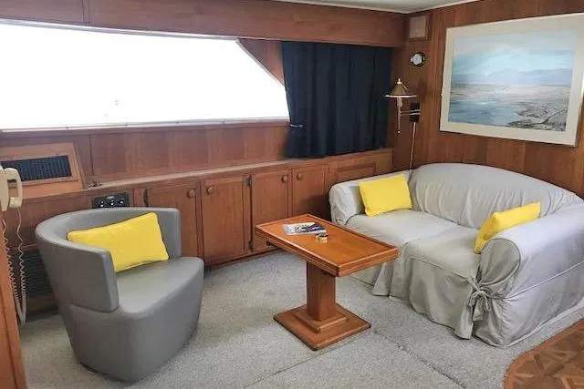 Slide: The Image of Interior of 1985 Chris Craft 500 yacht with cozy seating and nautical decor. - 13