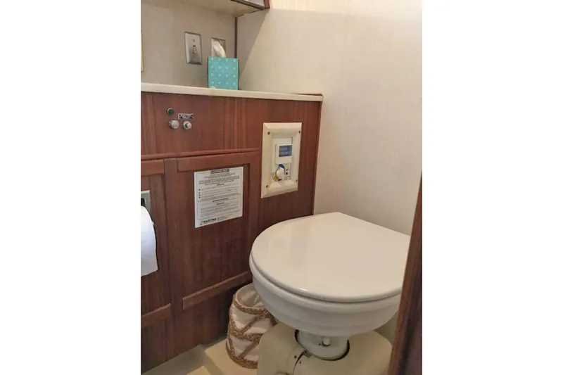 Slide: The Image of 1985 Chris Craft 500 yacht bathroom with wooden cabinetry and modern fixtures. - 37