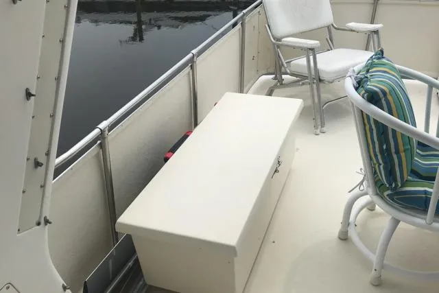 Slide: The Image of 1985 Chris Craft 500 yacht deck with seating and storage box. - 39