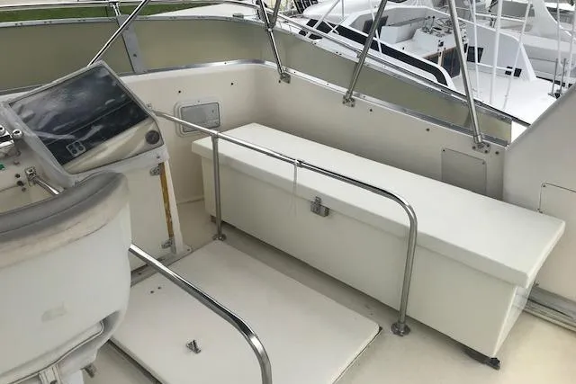 Slide: The Image of 1985 Chris Craft 500 yacht helm with seating and navigation equipment. - 41