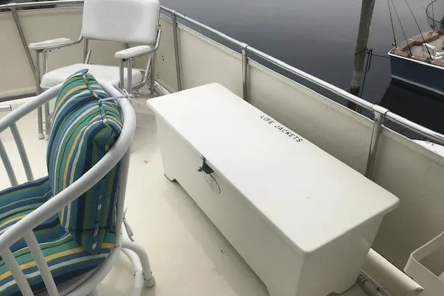 Slide: The Image of 1985 Chris Craft 500 yacht deck with chairs and life jacket storage box. - 42
