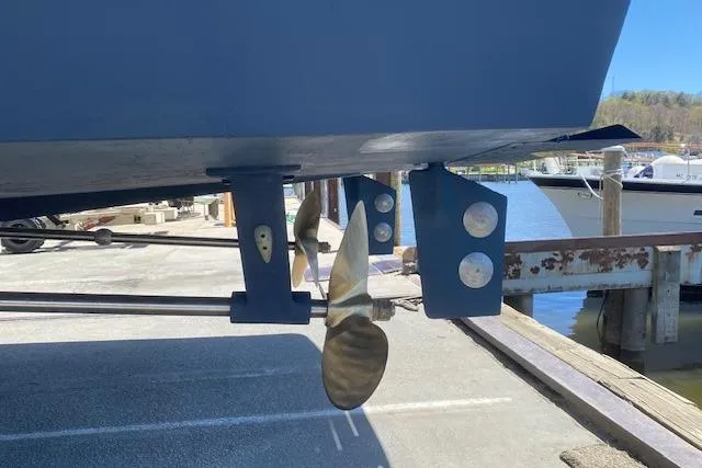 Slide: The Image of Propeller and rudder of a 1985 Chris Craft 500 boat on a dock. - 44