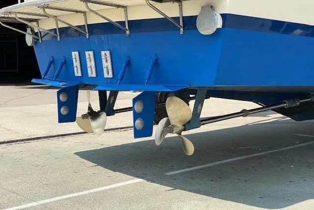 Slide: The Image of 1985 Chris Craft 500 boat stern with dual propellers and blue hull. - 46