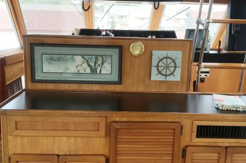 Slide: The Image of Interior of 1985 Chris-Craft 500 Constellation yacht with nautical decor and wooden cabinetry. - 9