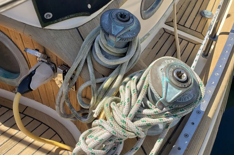 Slide: The Image of Deck of 1987 Hans Christian 33 sailboat with winches and coiled ropes. - 21