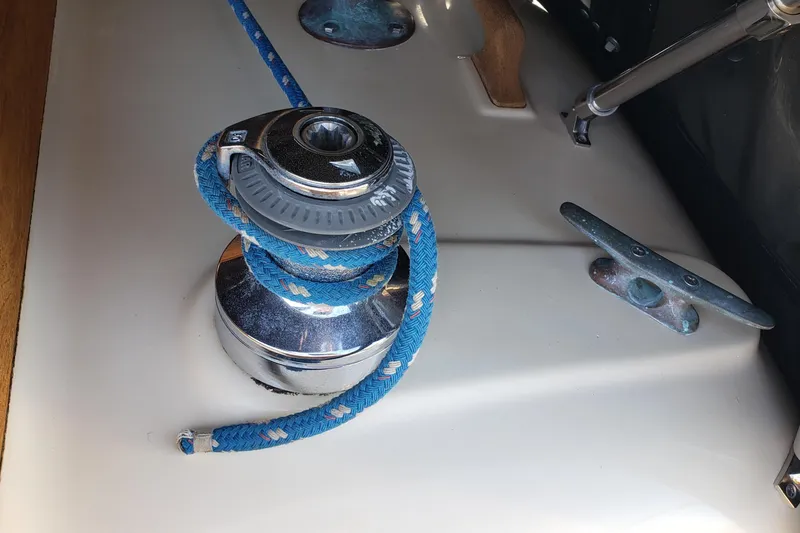 Slide: The Image of Winch with blue rope on 1987 Hans Christian 33 sailboat deck. - 22