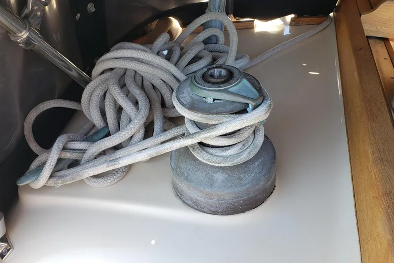 Slide: The Image of Winch with coiled rope on 1987 Hans Christian 33 sailboat deck. - 23