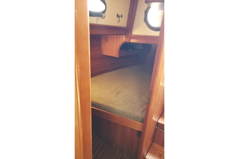 Slide: The Image of Cozy cabin interior of 1987 Hans Christian 33 sailboat with wooden finish. - 38