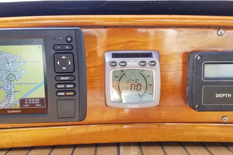 Slide: The Image of Navigation instruments on a 1987 Hans Christian 33 sailboat, featuring GPS and depth gauge. - 50