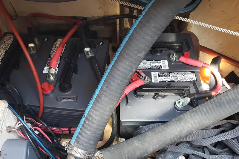 Slide: The Image of Battery compartment of a 1987 Hans Christian 33 sailboat with cables and hoses. - 57