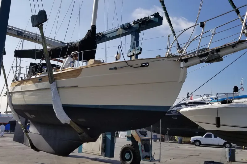 Slide: The Image of 1987 Hans Christian 33 sailboat in dry dock, undergoing maintenance and inspection. - 65
