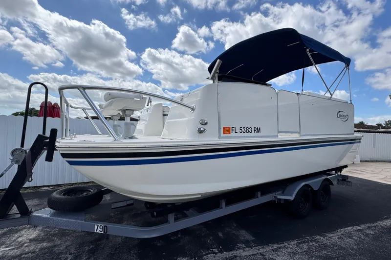 The Image of 2018 Beachcat 20 boat on trailer under blue sky with clouds. - 0