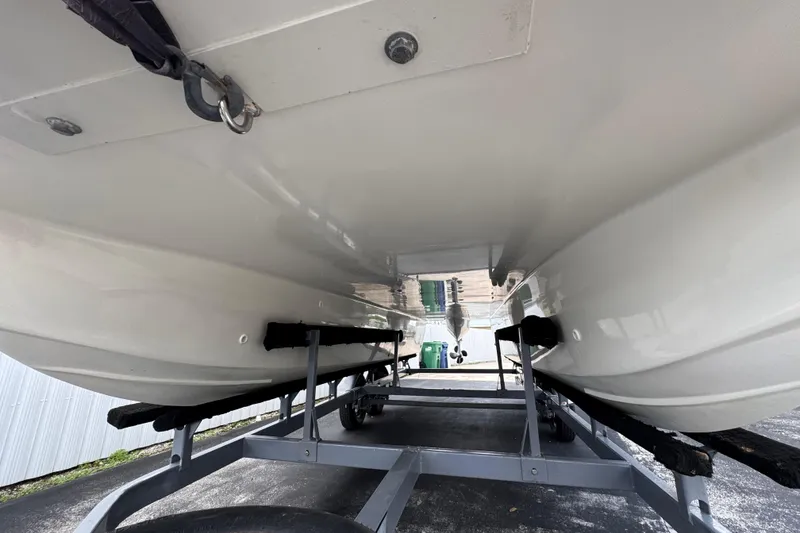 Slide: The Image of Underneath view of a 2018 Beachcat 20 boat on a trailer. - 12