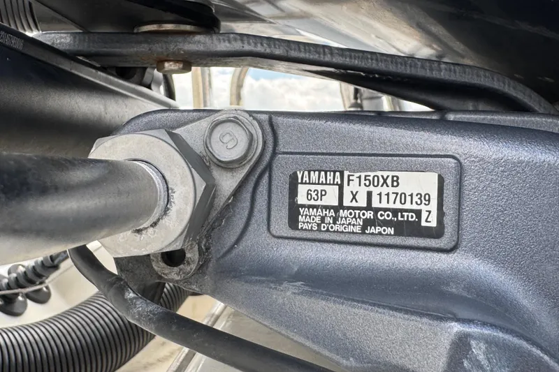 Slide: The Image of Close-up of Yamaha F150XB engine part on a 2018 Beachcat 20 boat. - 15