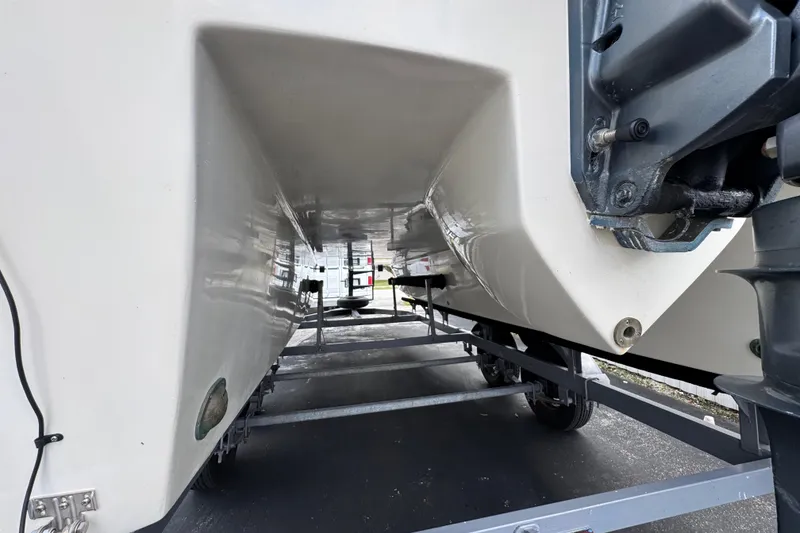 Slide: The Image of Underneath view of a 2018 Beachcat 20 boat on a trailer. - 16