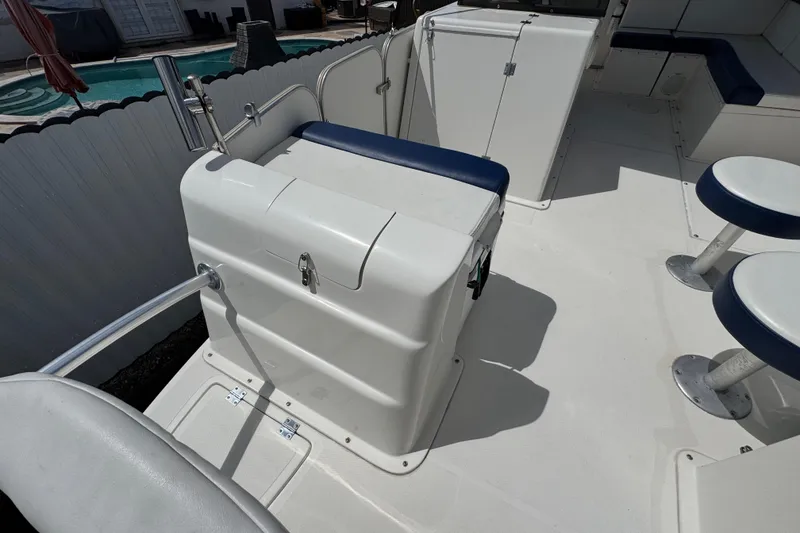 Slide: The Image of Interior of a 2018 Beachcat 20 boat with seating and storage compartments. - 21