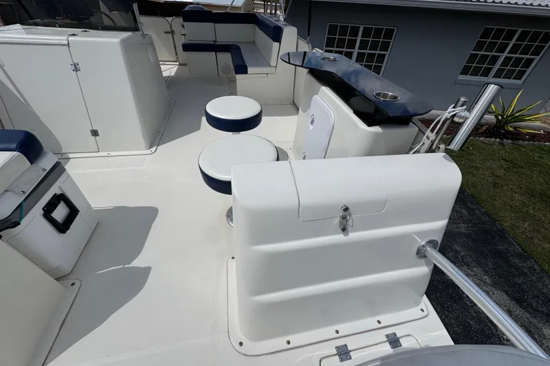 Slide: The Image of Interior of a 2018 Beachcat 20 boat with seating and storage compartments. - 22