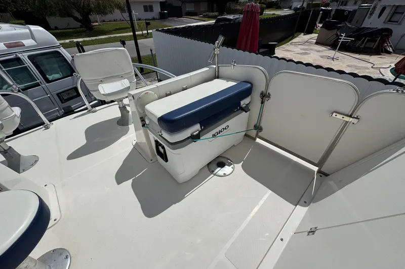 Slide: The Image of 2018 Beachcat 20 boat deck with seating and Igloo cooler. - 25