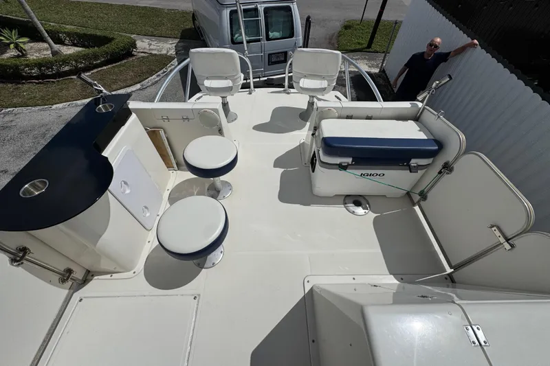 Slide: The Image of 2018 Beachcat 20 boat deck with seating, cooler, and bar area. - 26