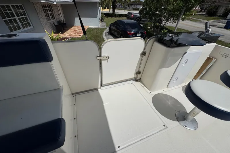 Slide: The Image of Interior of a 2018 Beachcat 20 boat with seating and storage compartments. - 28