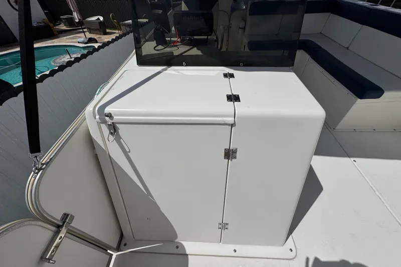 Slide: The Image of 2018 Beachcat 20 boat interior with seating and storage compartment. - 29