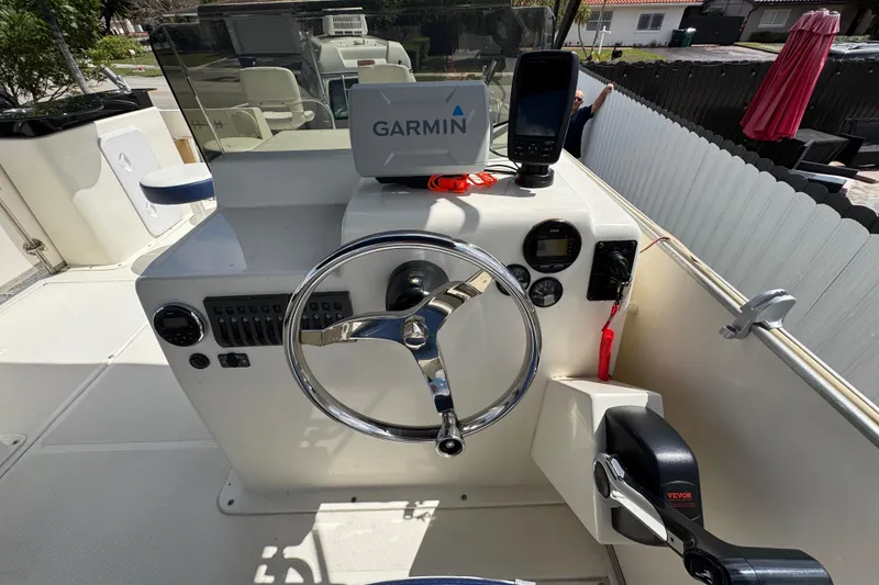 Slide: The Image of Steering console of a 2018 Beachcat 20 boat with Garmin navigation system. - 33