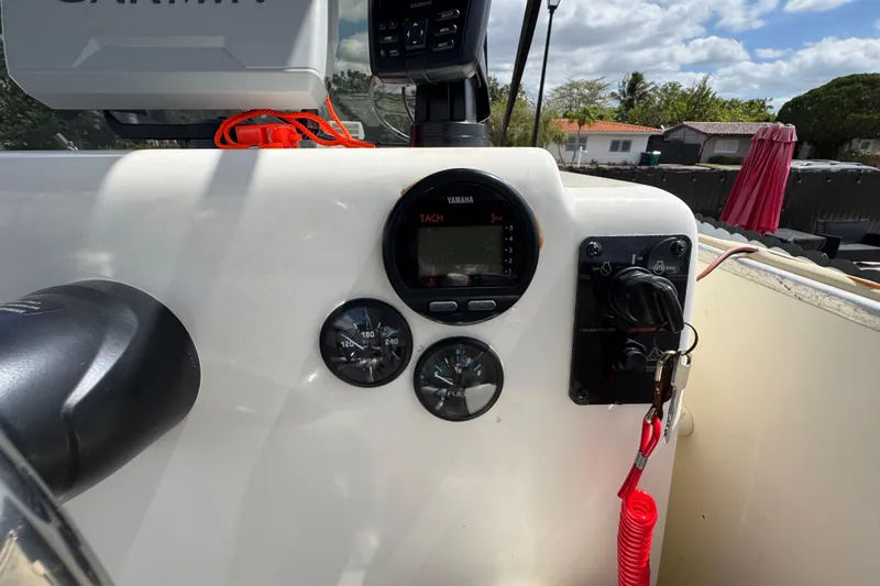 Slide: The Image of Control panel of a 2018 Beachcat 20 boat with Yamaha gauges and Garmin equipment. - 35