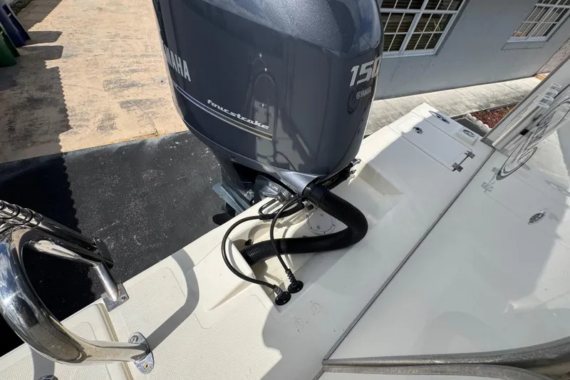 Slide: The Image of Outboard motor on 2018 Beachcat 20 boat, featuring Yamaha 150 horsepower engine. - 42