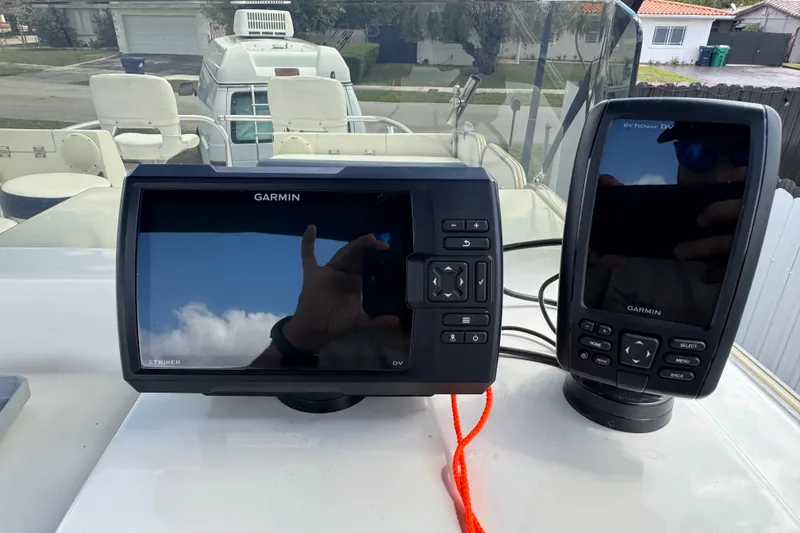 Slide: The Image of Garmin navigation devices on a 2018 Beachcat 20 boat dashboard. - 46